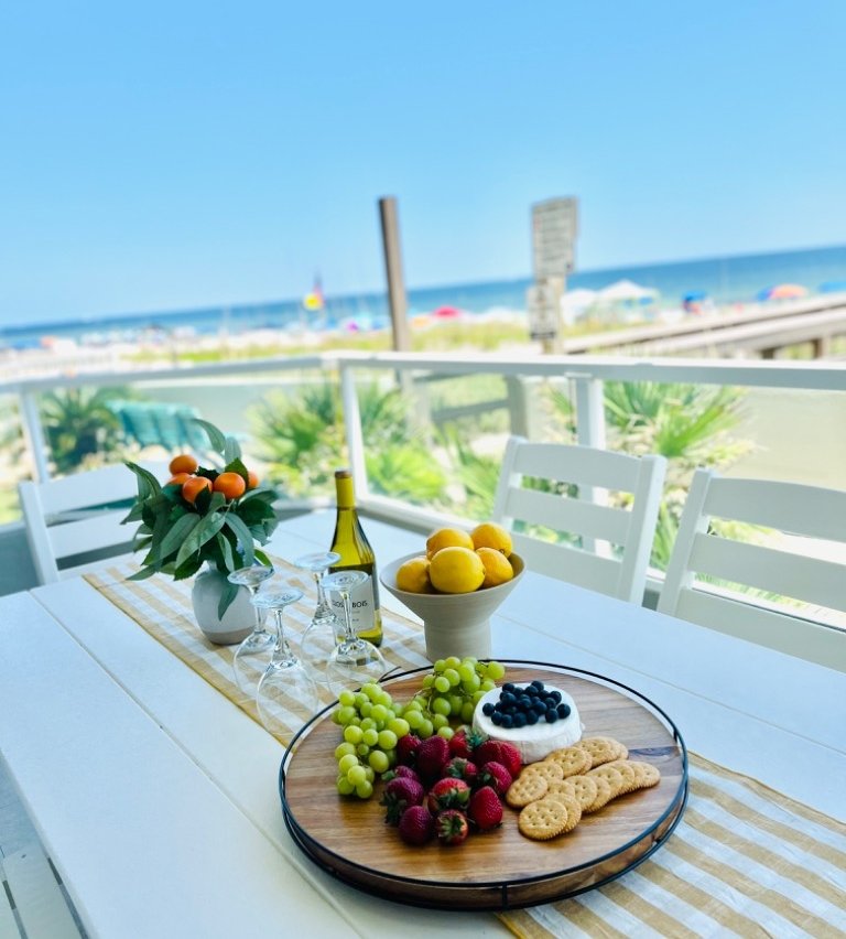Charcuterie board on the private Gulf-front balcony with view of beach and Gulf